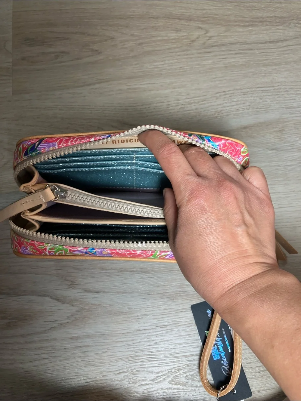 Consuela Pink Floral Embossed Zip Wristlet with Tan Strap